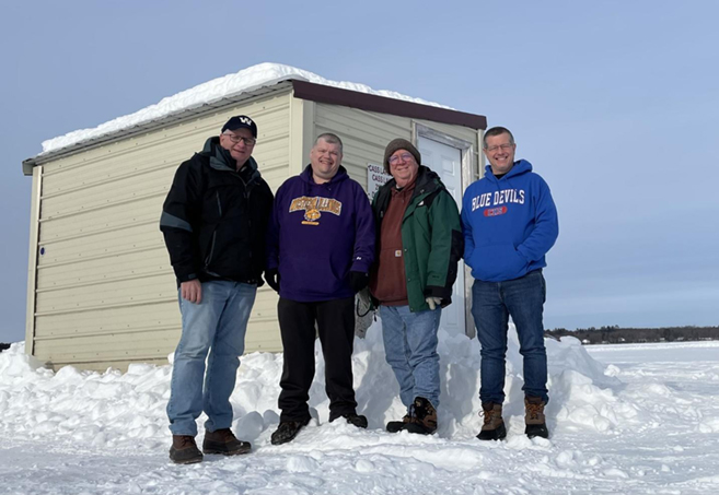 Men's fishing trio members at the fishing site