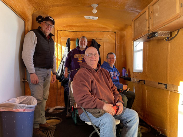 Men's fishing trio members at the fishing site