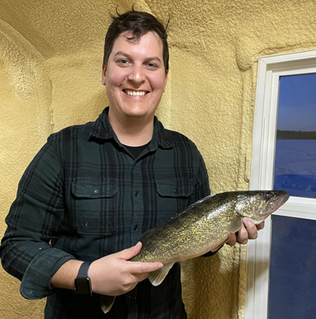 church member holding a fish