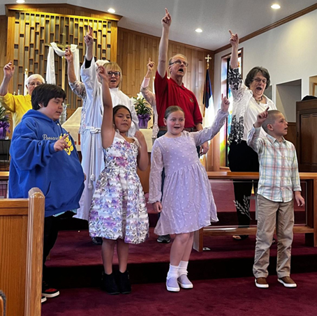 Children choir singing and dancing